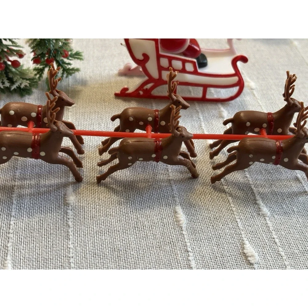 Vintage Look Miniature Plastic Santa in His Sleigh with Reindeer Cake Topper